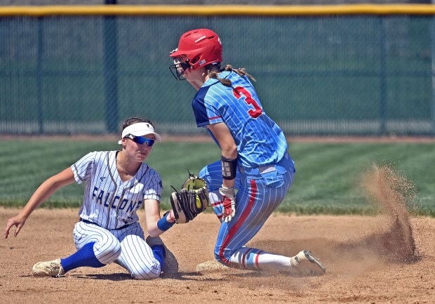 West Aurora's Sara Tarr steals second ahead of the tag by Wheaton North's 'Reagan Crosthwaite. West Aurora lost to Wheaton North 11-1, in a Class 4A Metea Valley Regional softball final, Saturday, May 25, 2024, in Aurora, Illinois. (Jon Langham/for the Beacon-News)