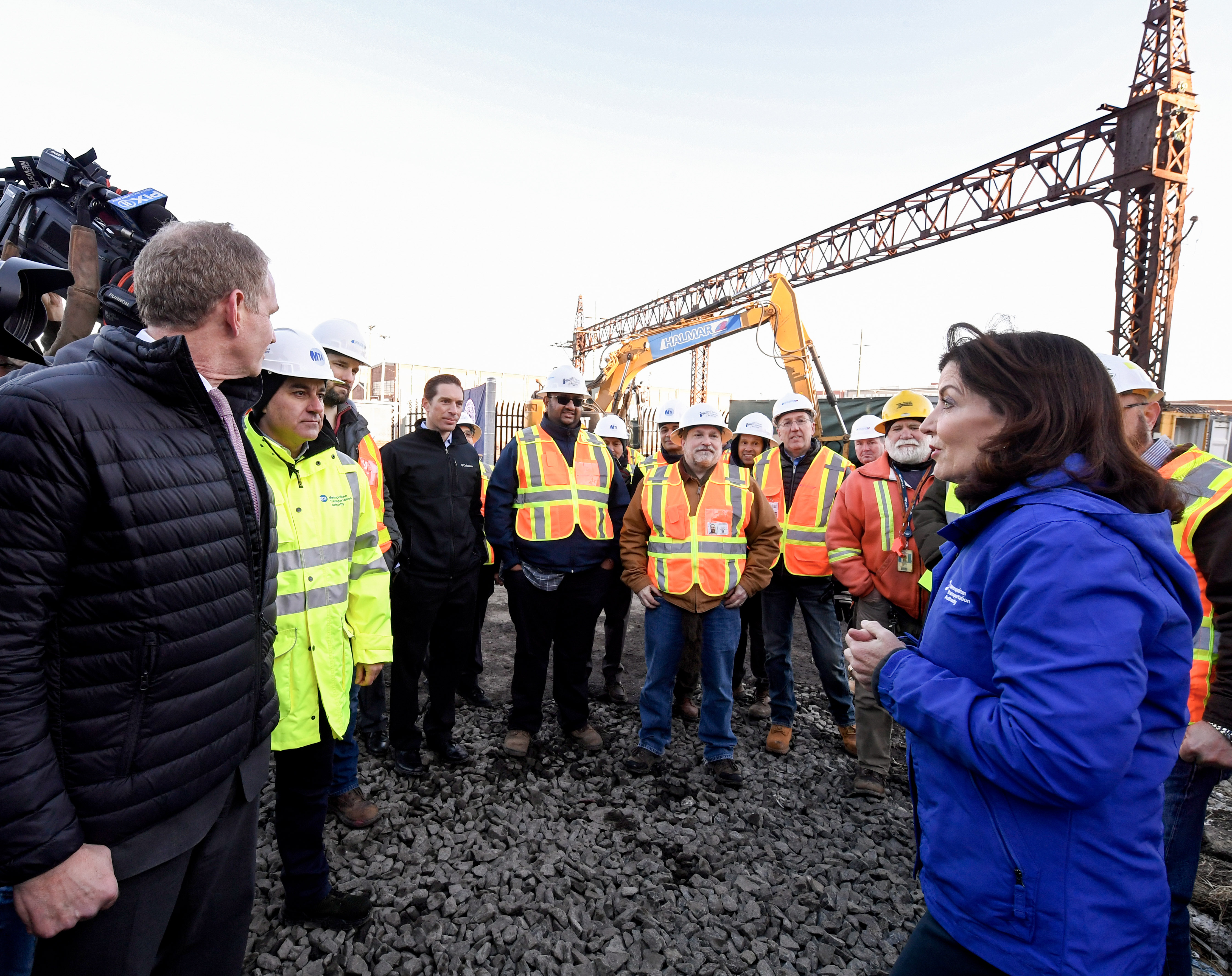 MTA officials and Governor Kathy Hochul on a construction site in the Bronx.