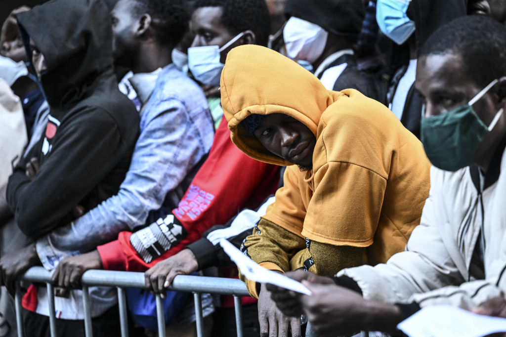 Migrants congregate outside Roosevelt Hotel in Manhattan on Aug. 2, 2023, waiting for placement inside a shelter.  While the city has accommodated tens of thousands of migrants since an influx that began two years ago, it also provides for some 2,000 migrants who were sent to communities outside of New York City, including in Buffalo.