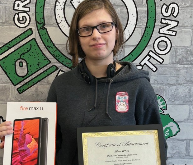 Oak Lawn Community High School graduating senior Eileen O'Neill holds a certificate and a tablet computer she won as part of a statewide poster contest. (OLCHS)