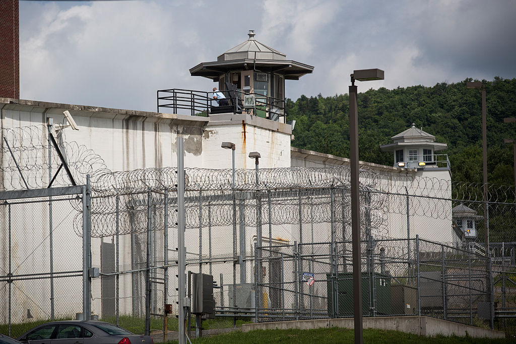 The Clinton Correctional Facility in upstate New York, a facility encapsulated by thick high walls and a guard tower.