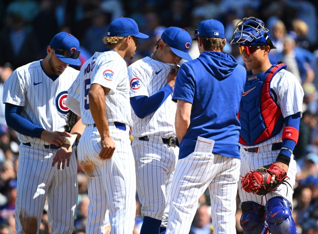 Pitching coach Tommy Hottovy #68 of the Chicago Cubs visits the mound to speak with Adbert Alzolay #73 of the Chicago Cubs during the eighth inning of a game against the Milwaukee Brewers at Wrigley Field on May 03, 2024 in Chicago, Illinois. The Brewers defeated the Cubs 3-1. (Photo by Nuccio DiNuzzo/Getty Images)