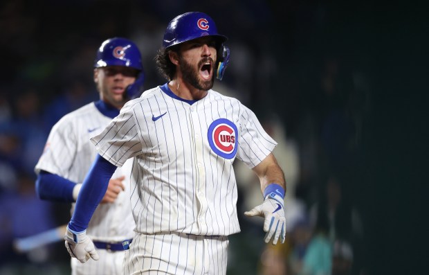 Chicago Cubs shortstop Dansby Swanson (7) celebrates as he runs into the dugout after hitting a 2-run home run in the 8th inning of a game against the Cincinnati Reds at Wrigley Field in Chicago on June 2, 2024. (Chris Sweda/Chicago Tribune)