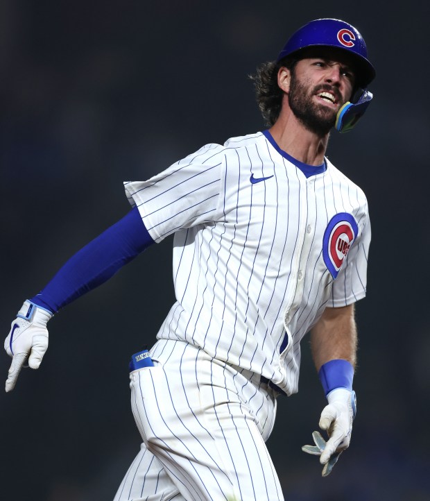 Chicago Cubs shortstop Dansby Swanson (7) celebrates as he rounds the bases after hitting a 2-run home run in the 8th inning of a game against the Cincinnati Reds at Wrigley Field in Chicago on June 2, 2024. (Chris Sweda/Chicago Tribune)