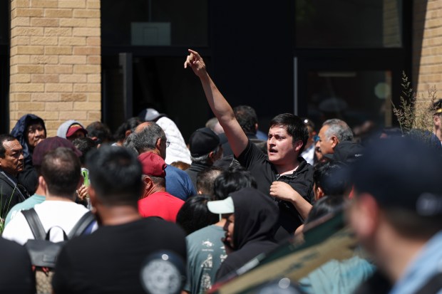 An election official tries to give instructions to people waiting to vote in the Mexican presidential election outside the Consulate General of Mexico in Chicago on June 2, 2024. (Eileen T. Meslar/Chicago Tribune)