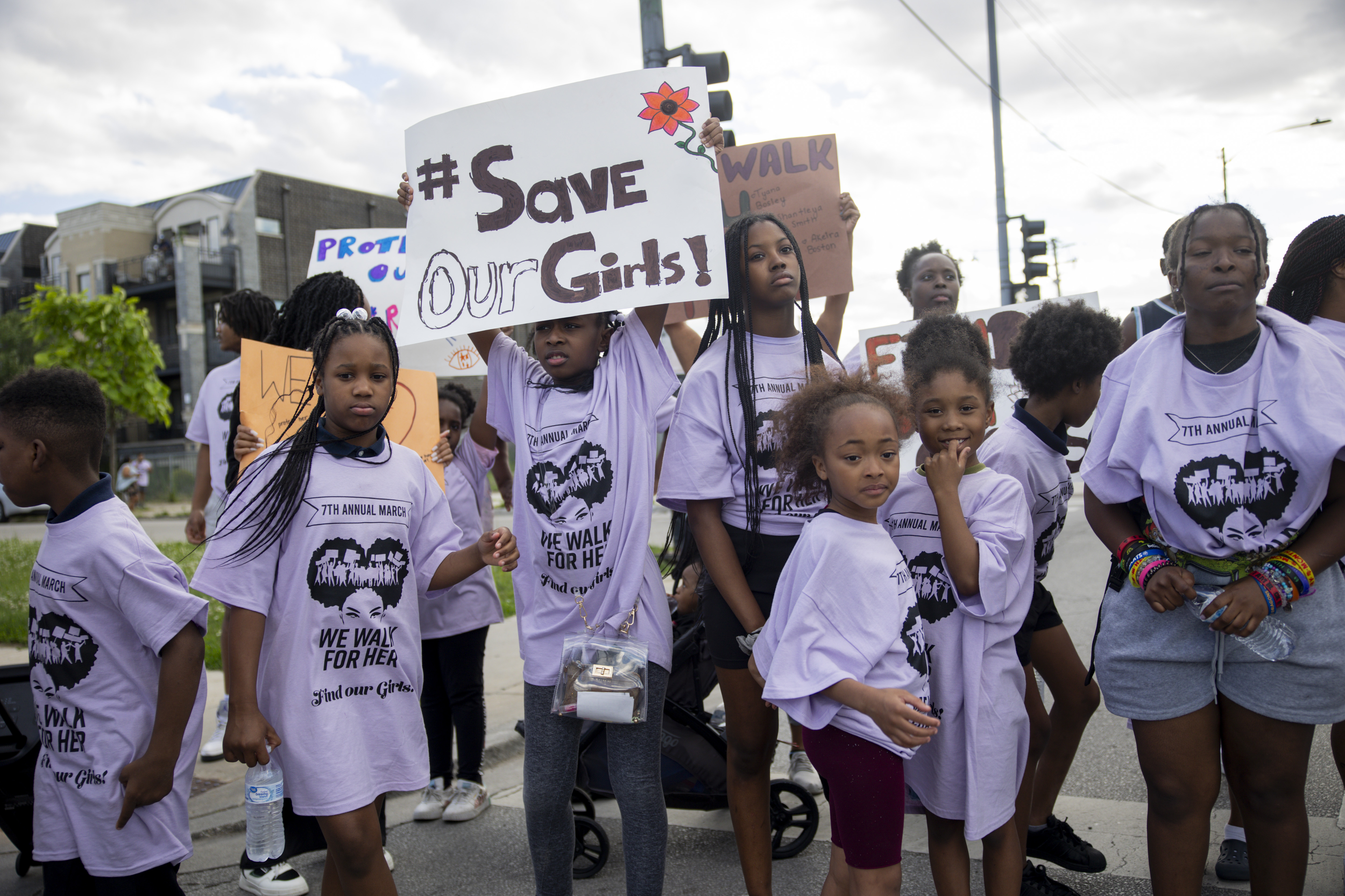 Young girls gather at the intersection of South King Drive...