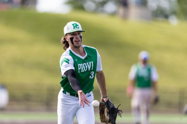 Providence picther Cooper Eggert flips a comebacker to first base against Edwardsville in the Class 4A state semifinals at Duly Health and Care Field in Joliet on Friday, June 7, 2024. (Vincent D. Johnson/for the Daily Southtown)