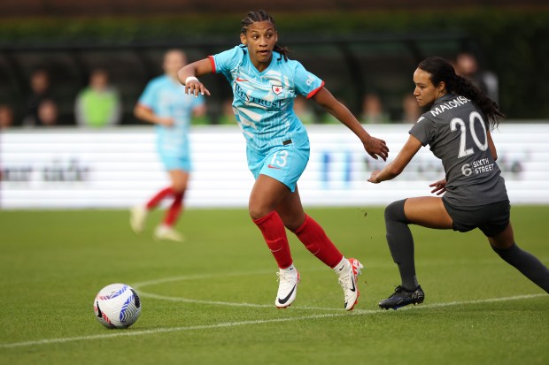 Chicago Red Stars midfielder Leilanni Nesbeth (13) gets past Bay FC Alyssa Malonson during their game at Wrigley Field on June 8, 2024. (Eileen T. Meslar/Chicago Tribune)