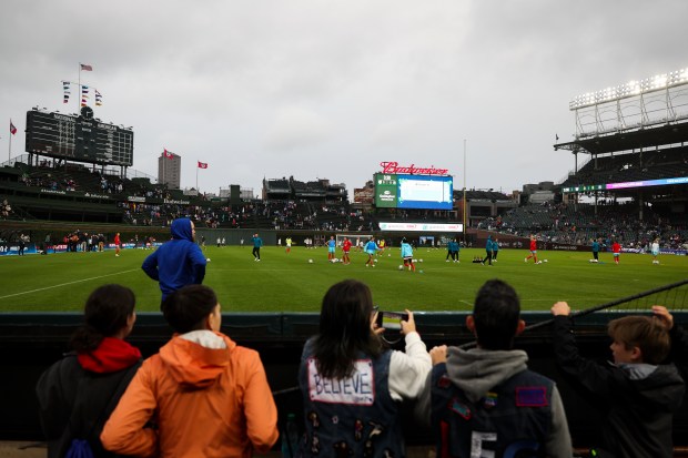 Fans watch the Chicago Red Stars warm up before their game against Bay FC on June 8, 2024, at Wrigley Field. (Eileen T. Meslar/Chicago Tribune)