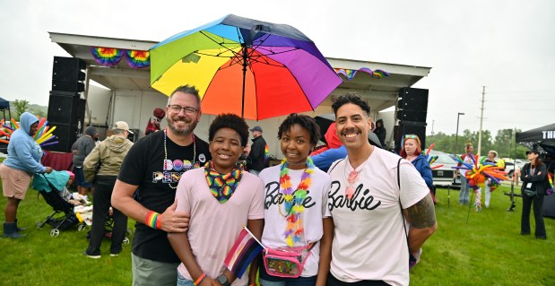 The drag show has just ended. In the audience was this Lake County family from Volo. Meet, from left to right, Daniel McCuiston, Martell Garcia-McCuiston, 14, a rising ninth-grader, Aaliyah Garcia-McCuiston, 16, a rising high school junior and Jorge Garcia-McCuiston at Lake County PrideFest 2024 in Round Lake Beach at the Round Lake Beach Cultural & Civic Center on June 8, 2024. (Karie Angell Luc/Lake County News-Sun)