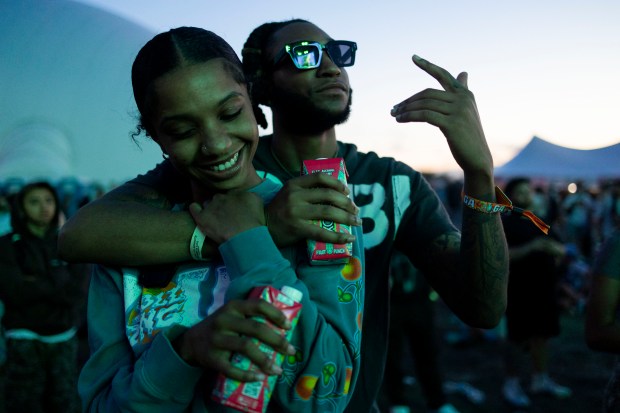 Lonvon Easley, left, and Kobe Jones, embrace while listening to a performance by Destroy Lonely on Friday, June 14, 2024, at the Summer Smash Music Festival at SeatGeek Stadium in Bridgeview, Ill.(Vincent Alban/Chicago Tribune)