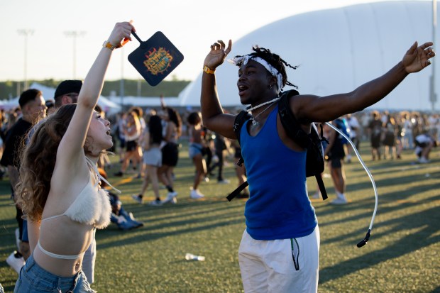 Hazeeb Atoro, right, and Sarah Hardison dance together on June 14, 2024, at the Summer Smash Music Festival at SeatGeek Stadium in Bridgeview. (Vincent Alban/Chicago Tribune)