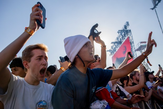 Dylan Whitlock, center, cheers during a performance by BLP Kosher on Friday, June 14, 2024, at the Summer Smash Music Festival at SeatGeek Stadium in Bridgeview.(Vincent Alban/Chicago Tribune)