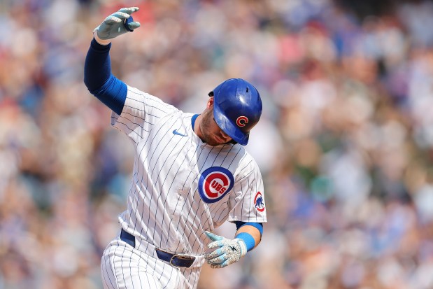 Ian Happ #8 of the Chicago Cubs rounds the bases after hitting a three-run home run off John King #47 of the St. Louis Cardinals (not pictured) during the seventh inning at Wrigley Field on June 15, 2024 in Chicago, Illinois. (Photo by Michael Reaves/Getty Images)