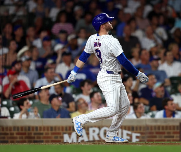 Chicago Cubs outfielder Ian Happ (8) hits a three-run homer in the bottom of the seventh inning during a game against the San Francisco Giants at Wrigley Field on June 17, 2024, in Chicago. Happ's homer put the Cubs ahead 6-3 but the lead did not hold. The Giants beat the Cubs 7-6. (Stacey Wescott/Chicago Tribune)