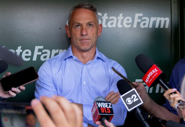 Chicago Cubs general manager Jed Hoyer speaks with the media in the Cubs dugout on a hot and humid 95 degree day before the start of a game between the Chicago Cubs and San Francisco Giants at Wrigley Field on June 16, 2024, in Chicago. (Stacey Wescott/Chicago Tribune)