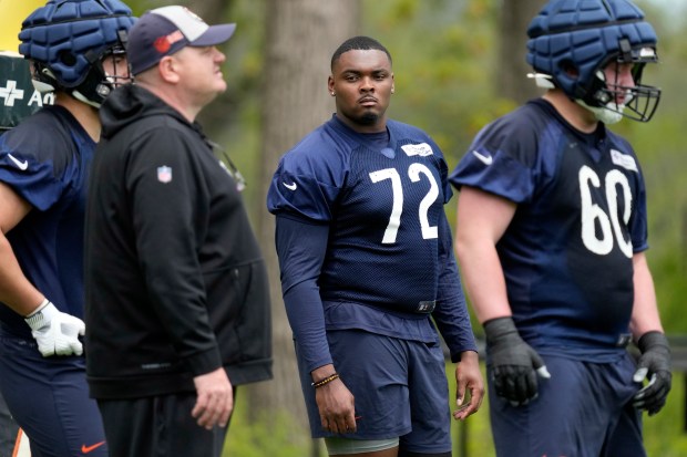 Bears offensive lineman Kiran Amegadjie watches players during rookie camp at Halas Hall on May 10, 2024. (AP Photo/Nam Y. Huh)