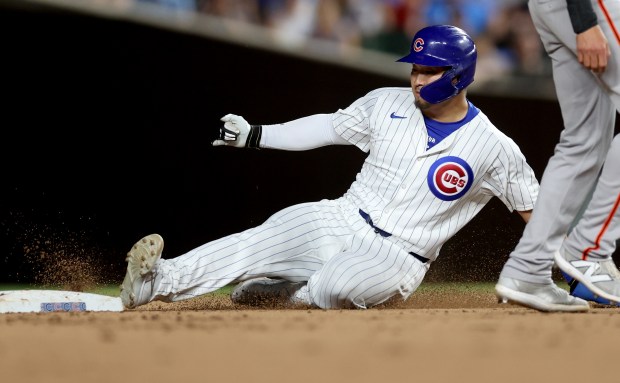 Chicago Cubs designated hitter Seiya Suzuki steals second base in the 8th inning of a game against the San Francisco Giants at Wrigley Field in Chicago on June 18, 2024. (Chris Sweda/Chicago Tribune)