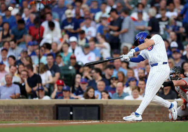 Chicago Cubs shortstop Dansby Swanson hits a 2-run home run in the second inning of a game against the San Francisco Giants at Wrigley Field in Chicago on June 18, 2024. (Chris Sweda/Chicago Tribune)