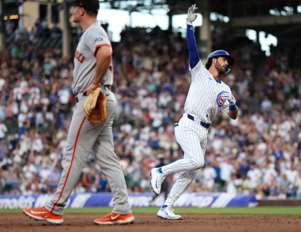 Chicago Cubs shortstop Dansby Swanson celebrates as he rounds the bases after hitting a 2-run home run in the second inning of a game against the San Francisco Giants at Wrigley Field in Chicago on June 18, 2024. (Chris Sweda/Chicago Tribune)