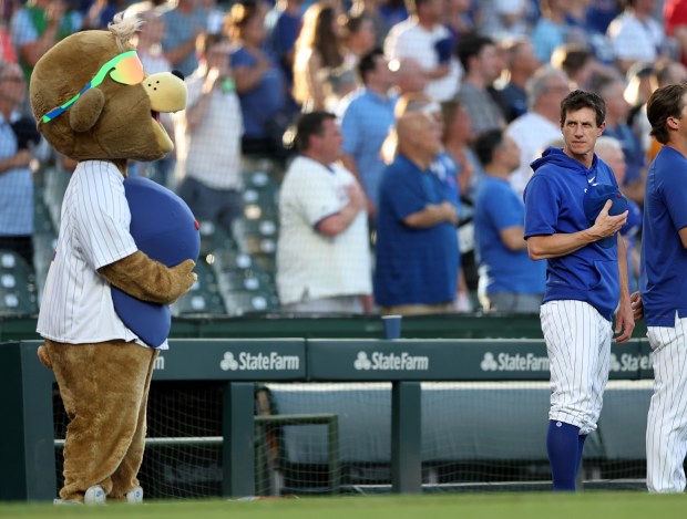 Chicago Cubs manager Craig Counsell stands for the national anthem before a game against the San Francisco Giants at Wrigley Field in Chicago on June 18, 2024. (Chris Sweda/Chicago Tribune)