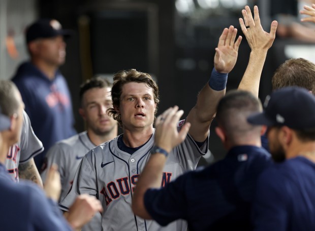 Houston Astros center fielder Jake Meyers (6) is congratulated by his teammates in the dugout after scoring on a single by teammate César Salazar in the sixth inning of a game against the Chicago White Sox at Guaranteed Rate Field in Chicago on June 19, 2024. (Chris Sweda/Chicago Tribune)