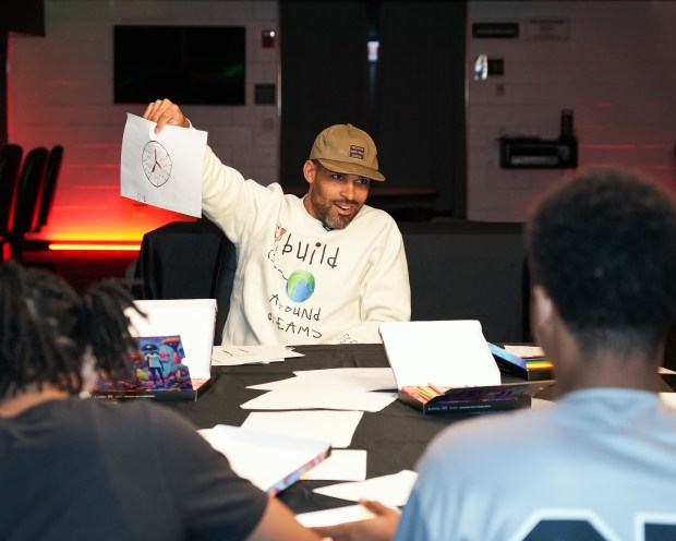 Former White Sox player Micah Johnson leads a creative session with members of the White Sox ACE program to collect inspiration and creative elements to design custom artwork in celebration of Juneteenth. (Kimberly Marroquin / Chicago White Sox)