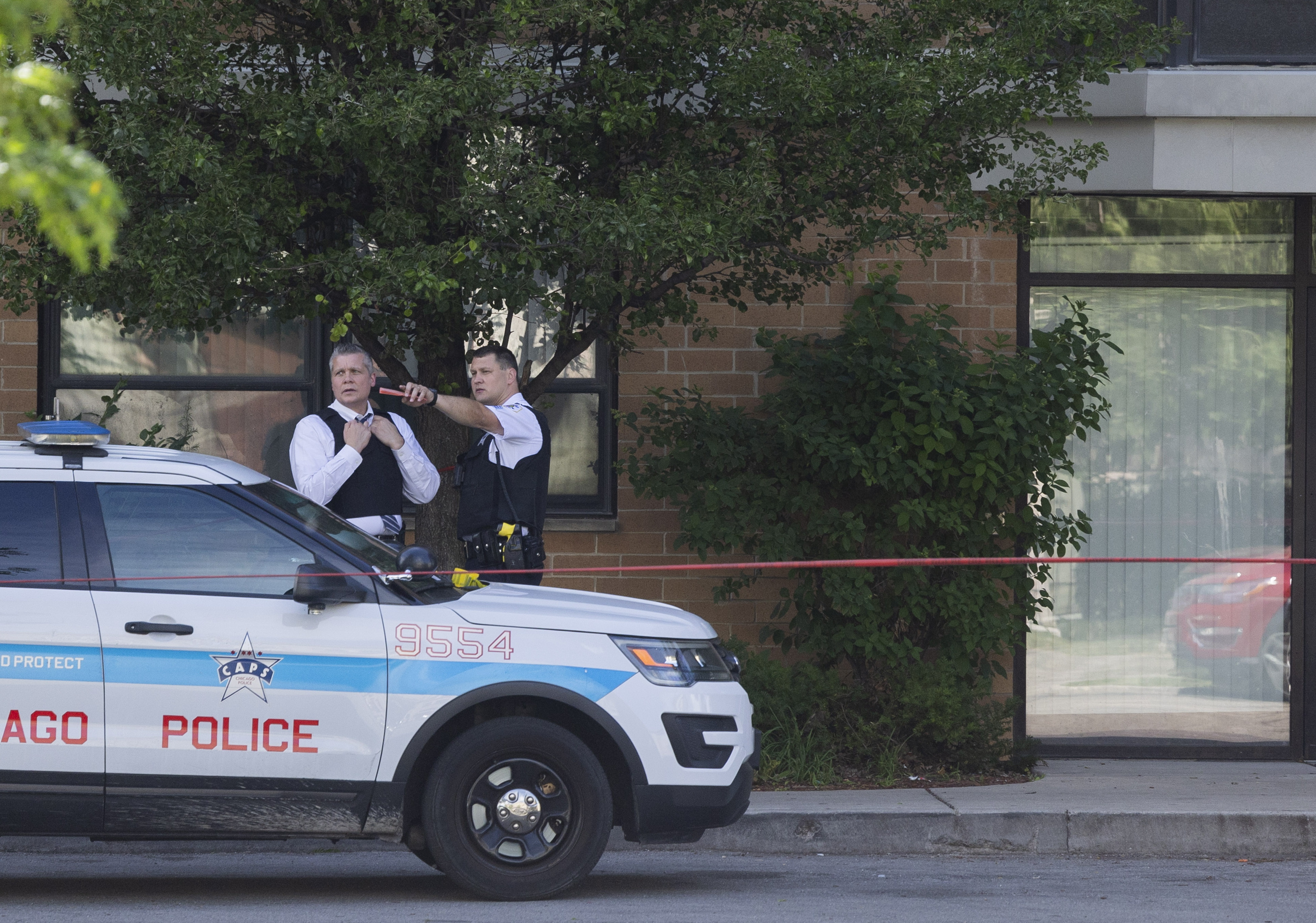 Chicago police work at the Oakley Square apartment complex on...