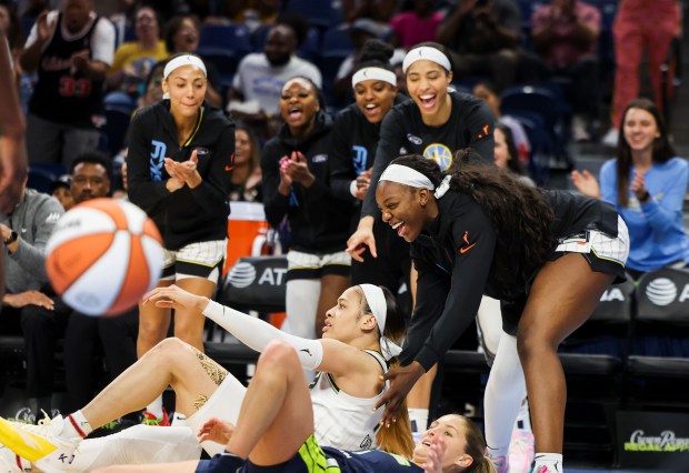 Chicago Sky forward Michaela Onyenwere helps guard Chennedy Carter (7) up after she scored while getting fouled by Dallas Wings guard Jacy Sheldon during the game at Wintrust Arena on June 20, 2024. (Eileen T. Meslar/Chicago Tribune)