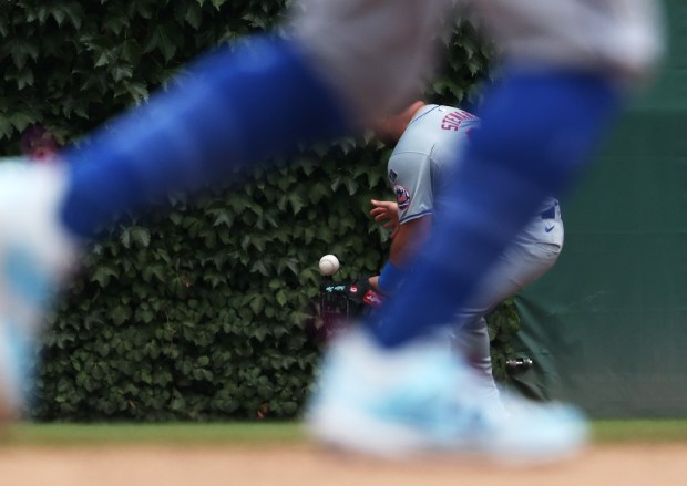 Mets right fielder DJ Stewart (29) fields an RBI double hit by Cubs catcher Tomás Nido in the sixth inning at Wrigley Field on June 22, 2024, in Chicago. (John J. Kim/Chicago Tribune)