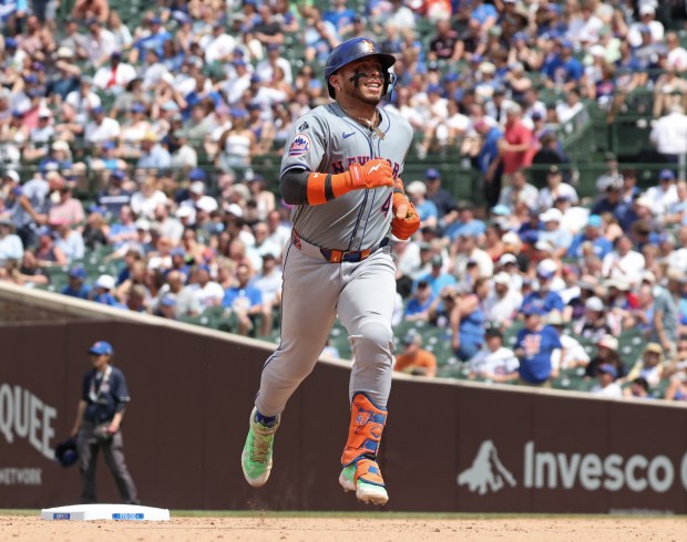 Mets catcher Francisco Alvarez rounds the bases after hitting a home run against the Cubs in the fifth inning at Wrigley Field on June 22, 2024, in Chicago. (John J. Kim/Chicago Tribune)