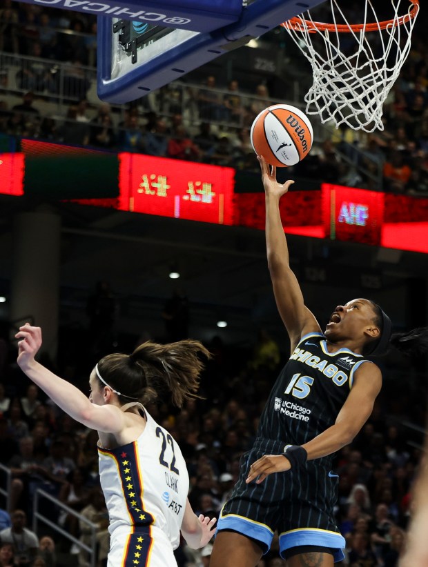 Chicago Sky guard Lindsay Allen (15) scores while guarded by Indiana Fever guard Caitlin Clark (22) during the game at Wintrust Arena on June 23, 2024. (Eileen T. Meslar/Chicago Tribune)