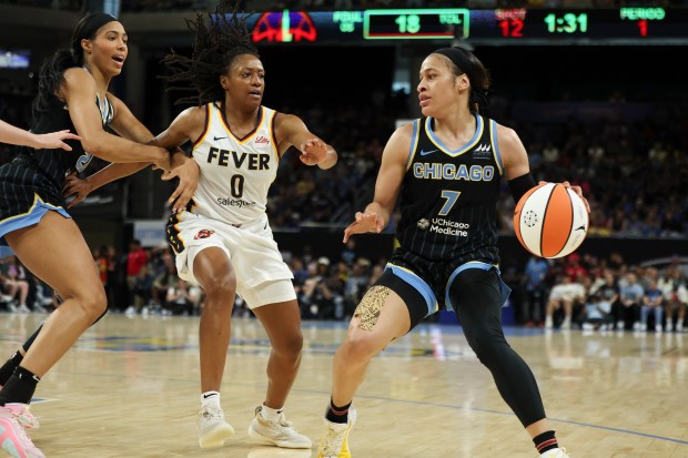 Chicago Sky guard Chennedy Carter (7) tries to keep the ball away from Indiana Fever guard Kelsey Mitchell (0) during the game against the Indiana Fever at Wintrust Arena on June 23, 2024. (Eileen T. Meslar/Chicago Tribune)