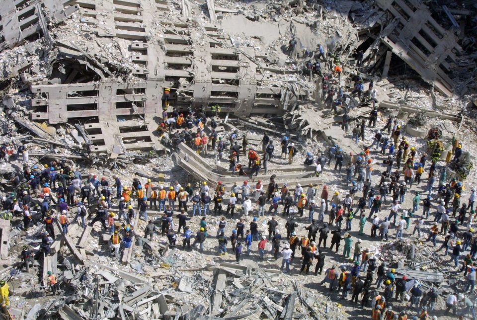 Rescue workers sift through the wreckage of the World Trade Center September 13, 2001.