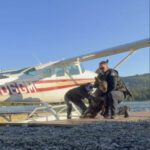 Baby moose trapped in a lake is saved by Alaska man and police as its worried mom watches