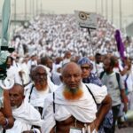 Pilgrims arrive to perform the symbolic