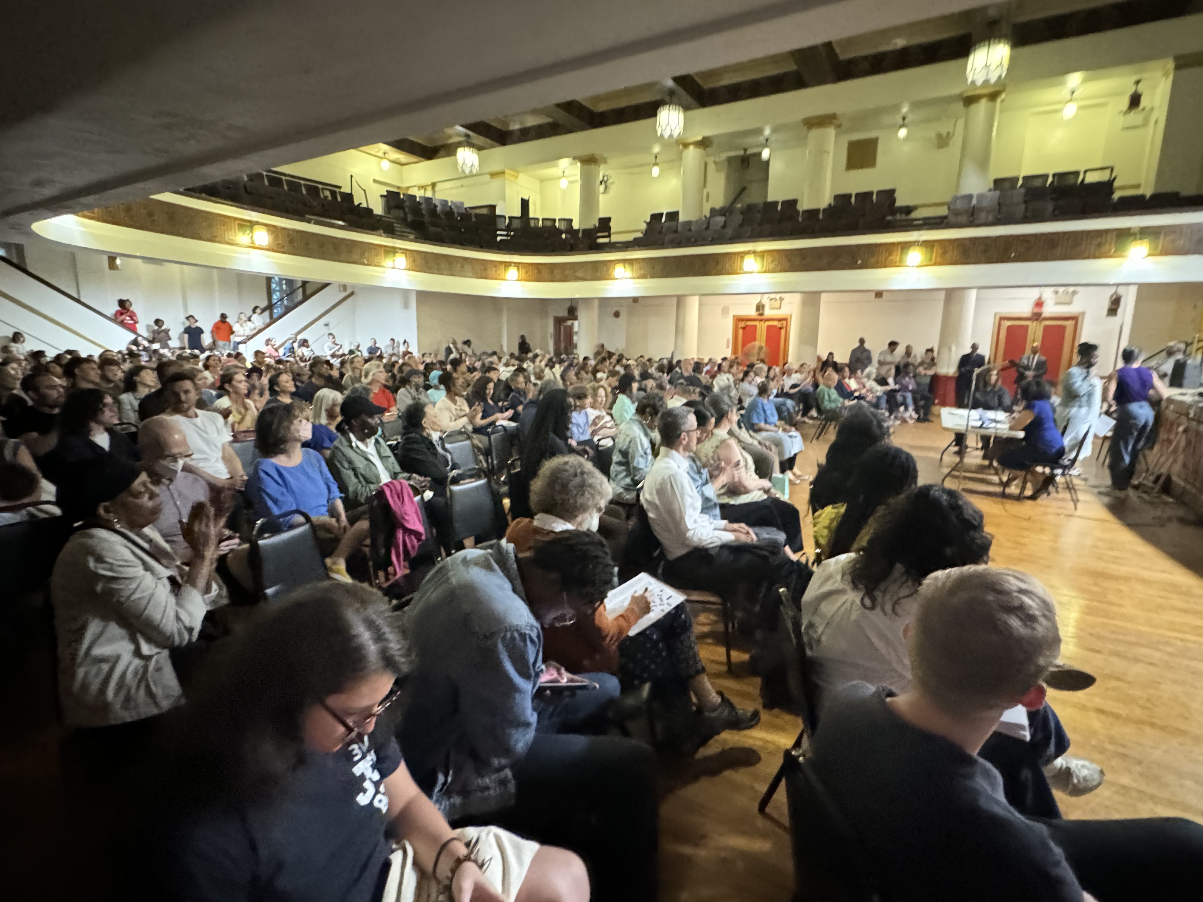 Neighbors of city shelters for migrants in the Clinton Hill section of Brooklyn gather in Brooklyn Masonic Temple  to discuss their concerns over the facilities. Nearly 3,900 migrants occupy shelters in the community.