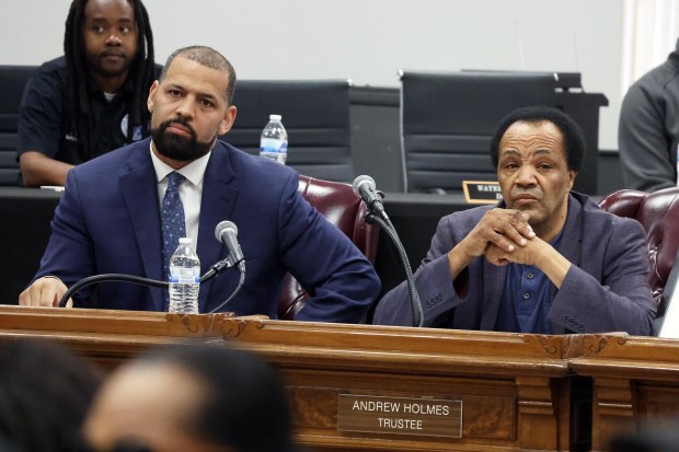 Dolton Village Trustee Jason House, left, and Trustee Andrew Holmes at the Dolton Village Board meeting June 3, 2024. (Terrence Antonio James/Chicago Tribune)