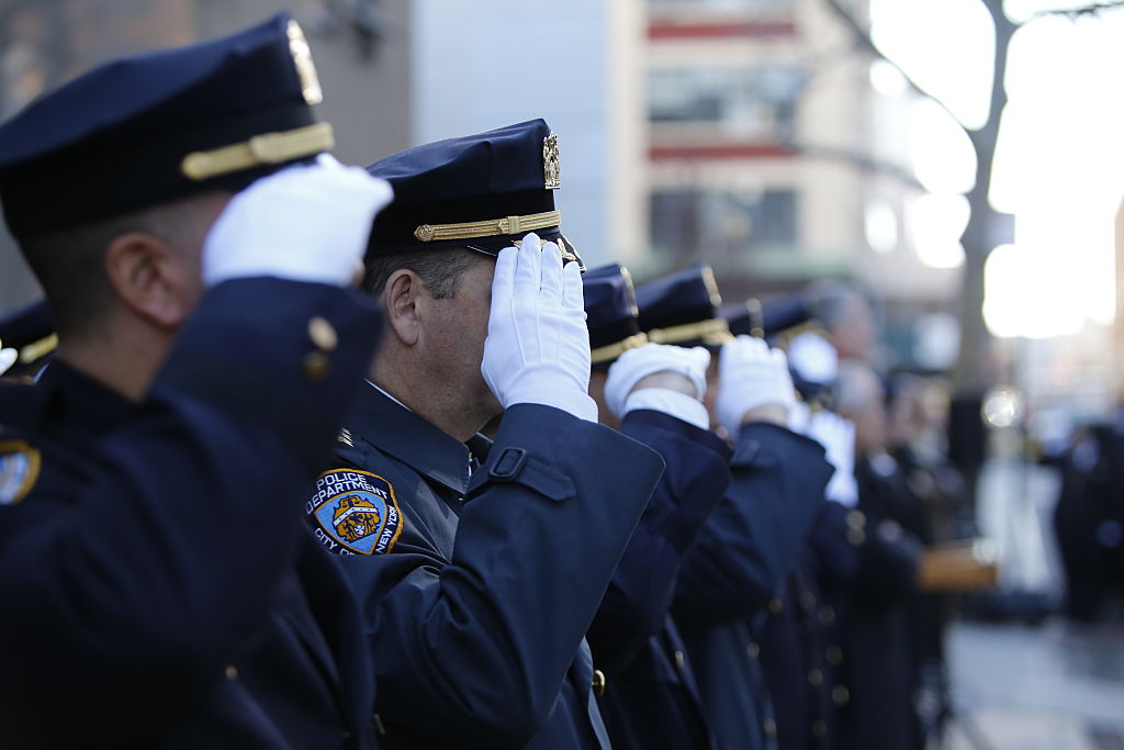 NYPD officers saluting