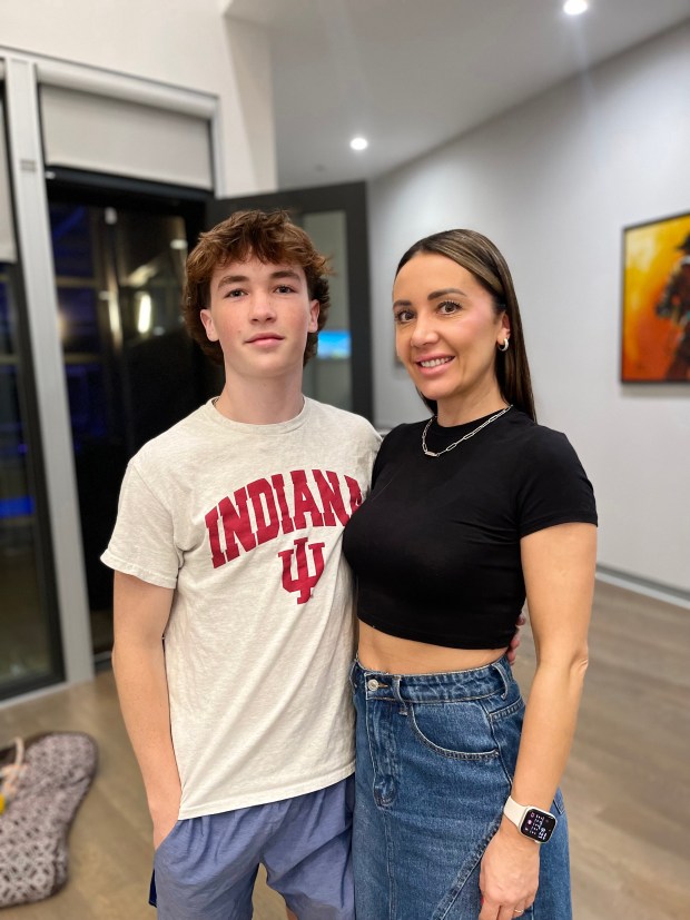 From left to right, Mark Masarsky, 18, of Northbrook and of the Glenbrook North High School Class of 2024, with parent Valeria Masarsky at a May 24, 2024 college commitment party at a friend's Northbrook home. (Photo courtesy of the Masarsky family)