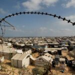 Displaced Palestinians shelter in a tent camp, in Rafah