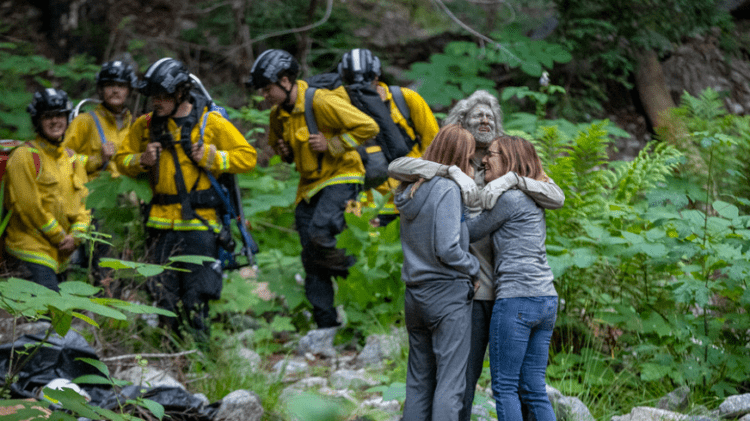 Photo of missing hiker hugging his family after he was found