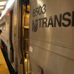 A person boards a NJ Transit train at the Hoboken Transit Terminal on September 1, 2023, in Hoboken, New Jersey.