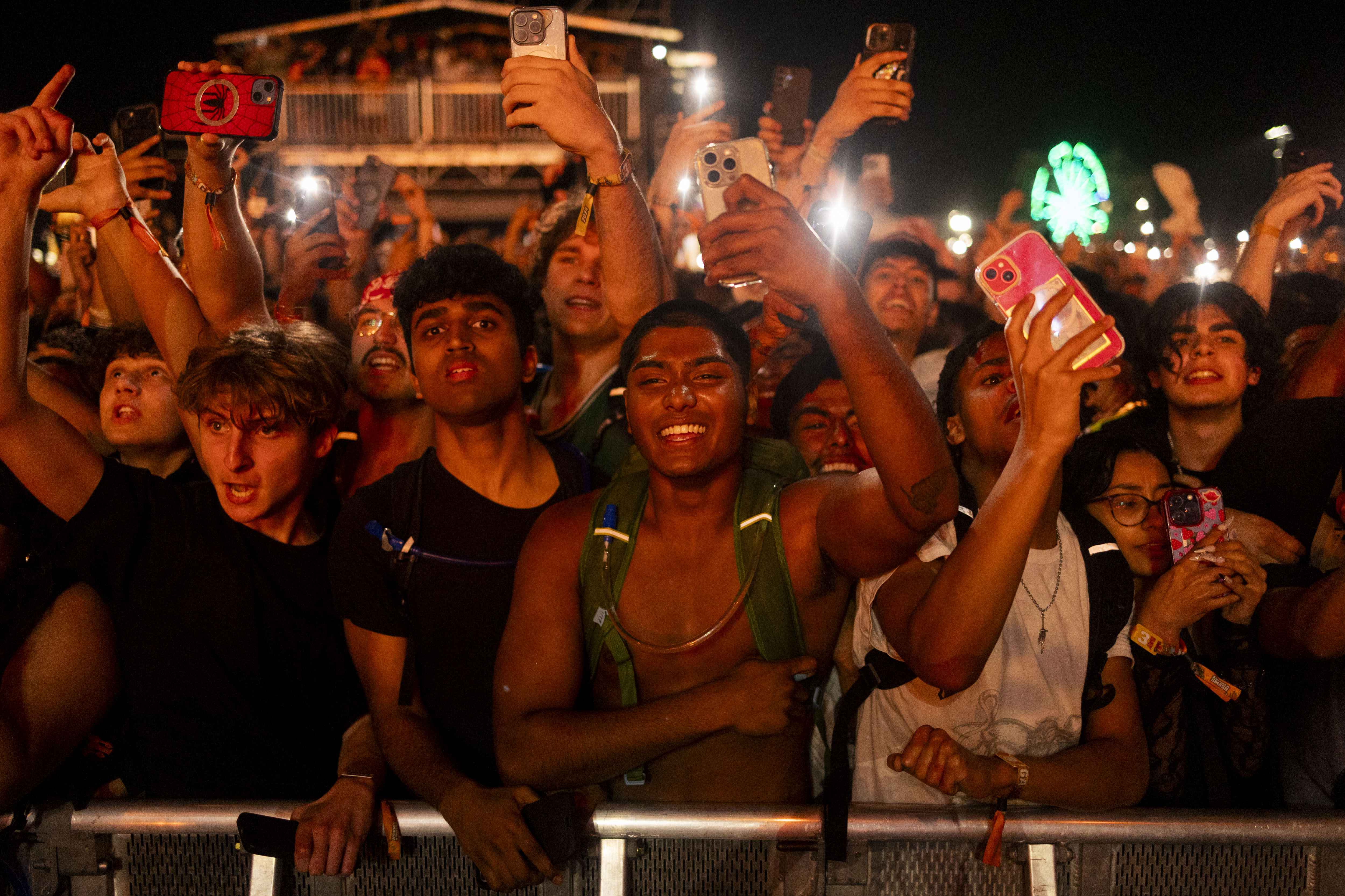 Festival goers cheer as Travis Scott and other members of the record label Cactus Jack perform on June 14, 2024, at the Summer Smash Music Festival in Bridgeview. (Vincent Alban/Chicago Tribune)