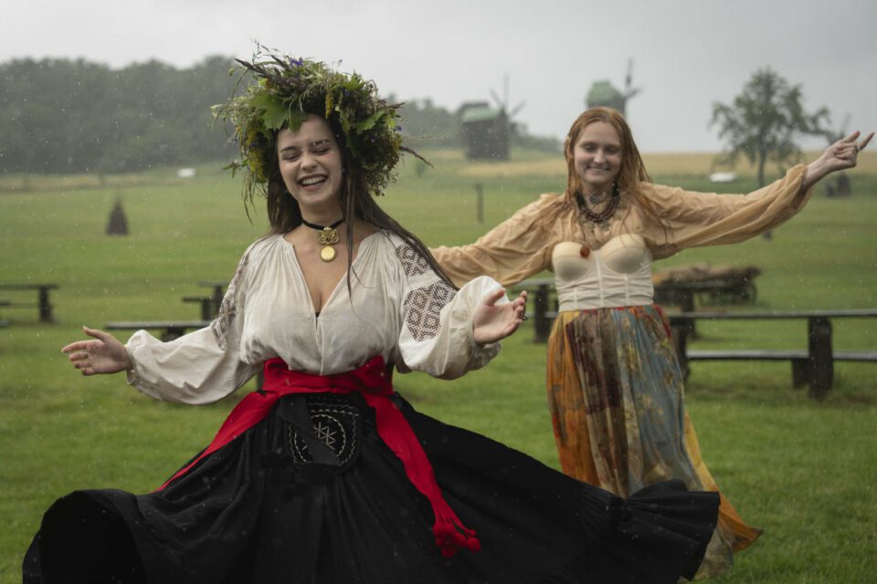 Under curfew, Ukrainians mark midsummer with bonfire jumping at a festival with pagan roots