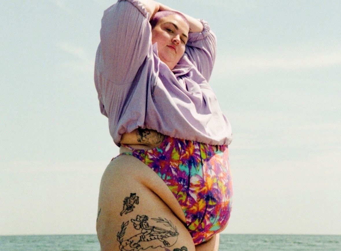 A person at the beach with the ocean in the background